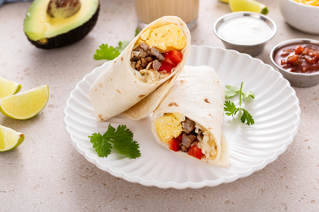 Breakfast burrito with sausage, eggs, bell pepper and cheese