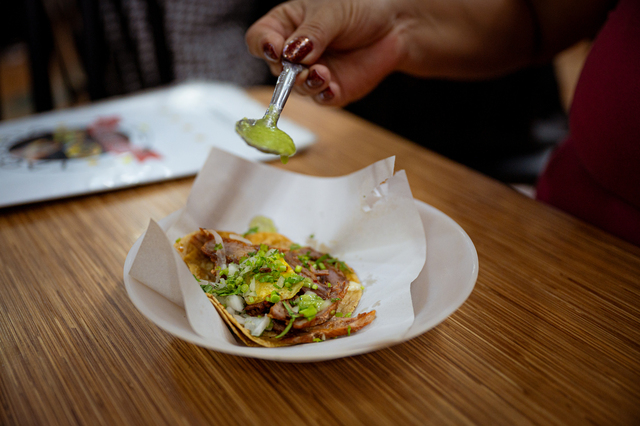small-vecteezy_mexican-woman-eating-tacos-al-pastor-mexican-food-in-mexico_47104925_small