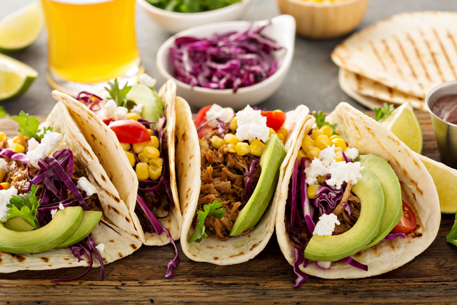 Pulled pork tacos with red cabbage and avocados